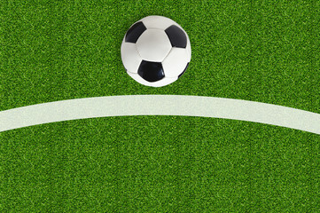 Soccer ball on green field grass