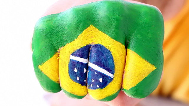 Brazilian soccer fan doing winning gesture