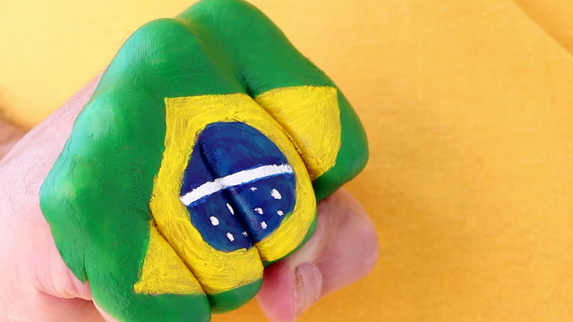Brazilian soccer fan doing winning gesture