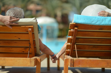 couple lying by pool