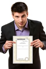Smiling young business man,showing a certificate