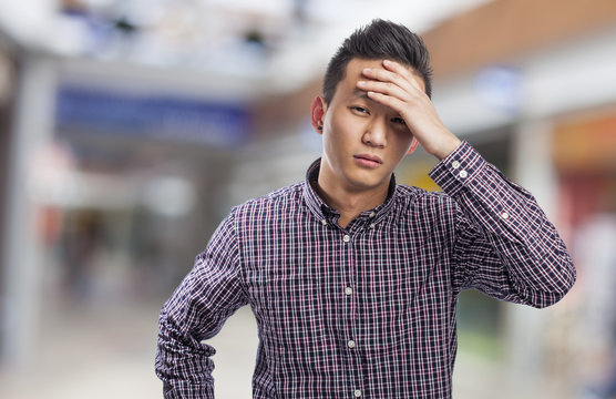 Young Asian Man With Problems, Worry Gesture