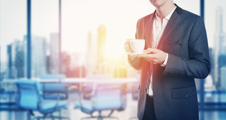 Businessman with cup of coffee