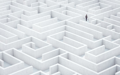 Businessman looking for way out of a maze