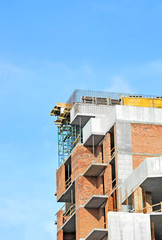 Building construction site work against blue sky