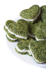 green heart shaped cookies with spinach and cream cheese