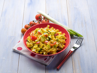 pasta with saffron cream sauce and sliced vegetables