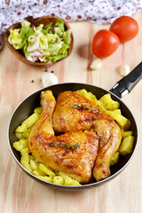 Roasted chicken legs with potatoes
