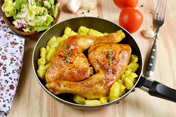 Roasted chicken legs with potatoes