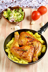Roasted chicken legs with potatoes