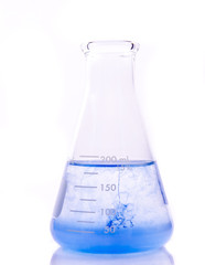 A blue liquid in an erlenmeyer flask isolated  background.