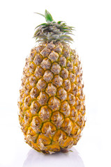 Fresh whole pineapple on a white background.