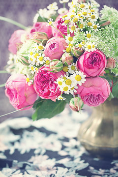beautiful bouquet of a fresh flowers roses and daisies