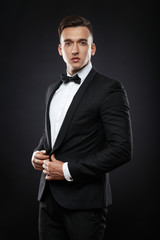 business man in suit on a dark background