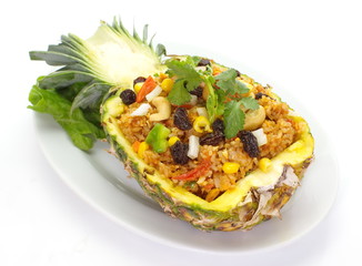 baked rice pineapple and vegetables served in pineapple