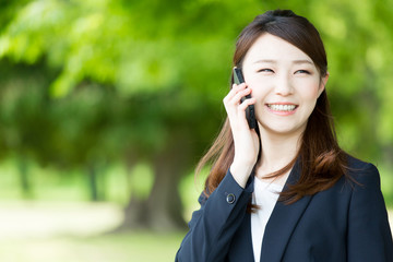 asian businesswoman using smart phone