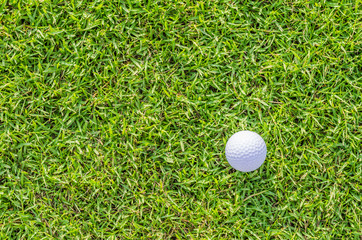 Golf ball on green grass