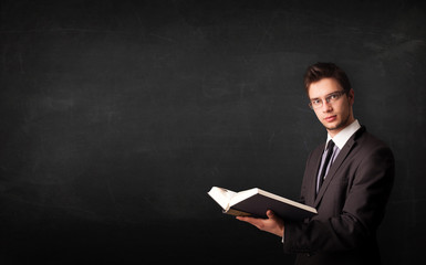 Young man reading a book