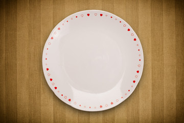Colorful empty plate on grungy background table