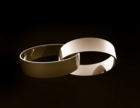 Gold wedding rings linked together