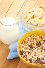 Plate with raw oatmeal on wooden table.