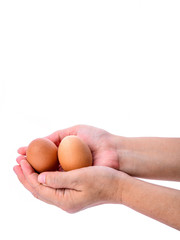 Chicken's egg in woman hand isolated on white.