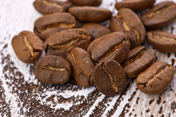Coffee beans on wood background
