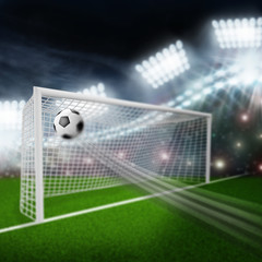 soccer ball flies into the goal