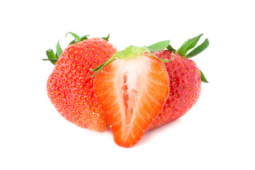 Three fresh strawberries and a slice