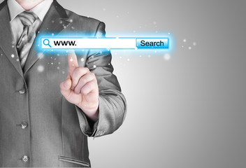 Businessman pushing virtual search bar