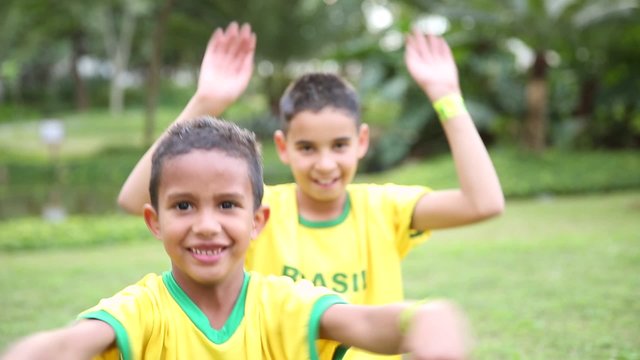 Two Brazilians supporters celebrate in the park