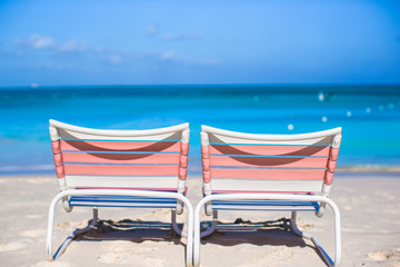 Two loungers on the exotic resort at white sand beach