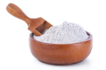 Bowl and  scoop with flour made up of whole grain cereals