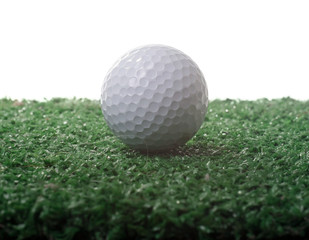 Golf ball ower green grass