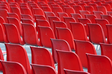 Red empty seats in stadium