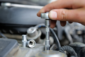 Hands of car mechanic