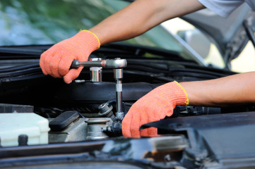 Hands of car mechanic