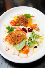 Octopus carpaccio in plate