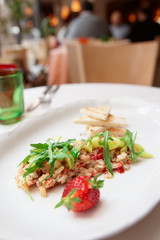 Seabass carpaccio on restaurant table