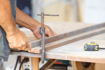 carpenter cut wood for house construction