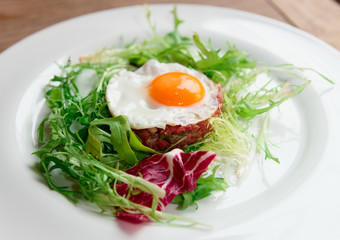 Beef tartar with fried egg