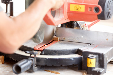 carpenter cut wood for house construction