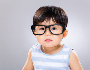 Cute baby boy with glasses