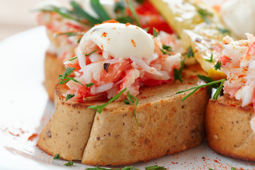 Crab meat with toast, sauce and fresh herbs