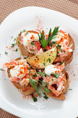 Crab meat with toast, sauce and fresh herbs