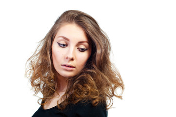 Beautiful young woman with evening make-up and volume hairstyle