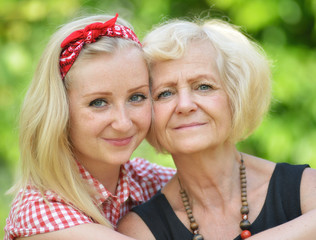 Mother and daughter in park.
