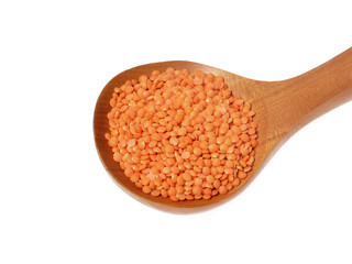 Red lentils on Wooden Spoon ,isolated white background