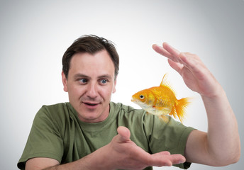Surprised man with a goldfish