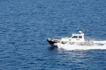 Pilot Boat Cutting Across Blue Water